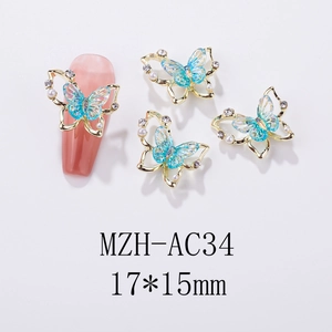 Detail of 17x15mm laser aurora butterfly nail charm with gold base and pearls