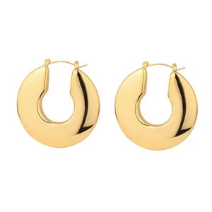 Macro shot of polished thick gold hoop earrings crafted from sleek titanium steel