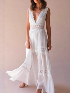 Elegant white sleeveless V-neck lace maxi dress with tiered layers for summer vacation wear