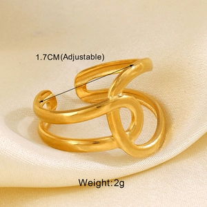 Detail view of adjustable gold heart ring on silk showing size and weight specs
