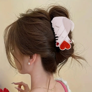 Elegant heart-shaped hair claw clip with rhinestones for women's updo hairstyles