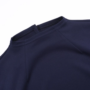 Detailed close-up of neckline and shoulder stitching on navy long sleeve dress