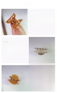 Detail of amber and pearl white acetate hair claw clips with metal spring mechanism