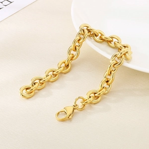 Detailed shot of gold hollow steel ball chain bracelet with high-polish finish and lobster clasp