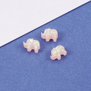 Detail of pink elephant opal beads with iridescent flakes for DIY jewelry crafts