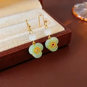 Gold plated flower drop earrings with zircon and green petals in traditional style