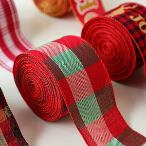 Rolls of Christmas faux linen ribbons with classic buffalo plaid and snowflake patterns