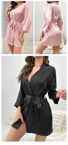 Detail showing pink and black satin short robes with elegant V-neck and belted waistline