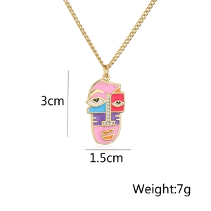 Detailed view of abstract face pendant with dimensions 3cm x 1.5cm and 7g weight