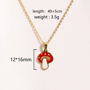 Detail view of gold chain necklace with red mushroom pendant and dimension specs