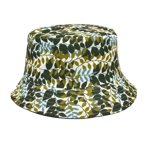 Close-up of green leaf print bucket hat with precision stitching on cotton fabric