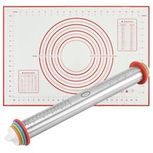 Macro view of adjustable stainless steel rolling pin and silicone pastry mat with measurements