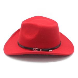 Detail of red felt cowboy hat featuring a black leather band and silver buckle accent
