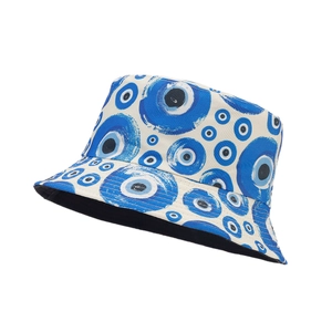 Reversible canvas bucket hat with blue evil eye graffiti print on white background