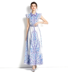 Detail of purple paisley print maxi dress with lapel collar and waist belt detail