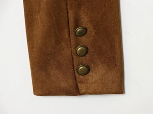 Close-up of dark brown suede coat cuff featuring three vintage copper-tone metal buttons