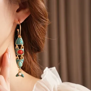Vintage gold fish articulated earrings with green enamel and colorful gemstones
