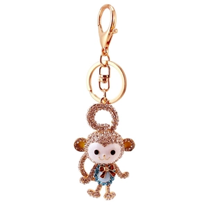 Sparkling crystal monkey keychain for car keys and bags with gold-plated metal finish