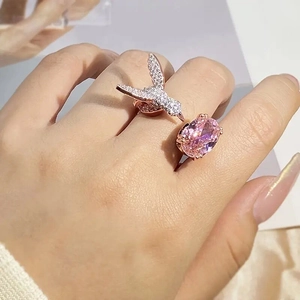 Elegant hummingbird open ring with pink oval stone and sparkling crystals in rose gold