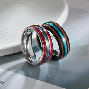 Titanium rings with acacia wood inlay and blue opal or colorful abalone shell patterns