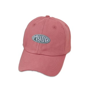 Detailed close-up of M.Y.O.B embroidery on a brick red cotton twill baseball cap