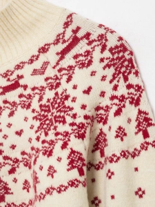 Detail of high collar ribbed knit sweater with red reindeer and snowflake jacquard patterns