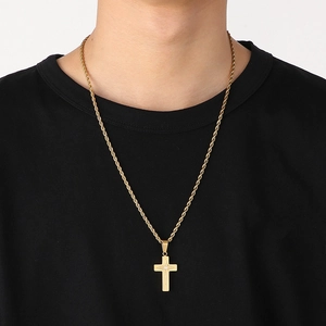 Gold stainless steel four-pointed star cross pendant necklace with twisted chain on model