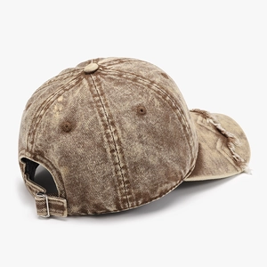 Distressed tan baseball cap with vintage washed acid finish and frayed edge details