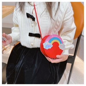 Detailed view of kids red round crossbody bag with sequin rainbow and holographic clouds