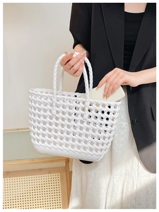 Detail showing the large capacity of this white hand-woven basket bag for beach vacations
