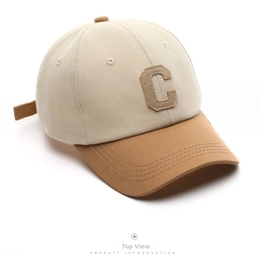 Detail view of two-tone baseball cap with a khaki C patch and breathable eyelets