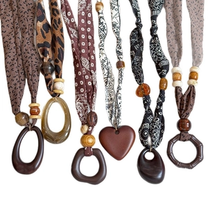 Ethnic bohemian necklaces set with leopard fabric, wooden beads and heart pendants