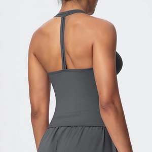 Close-up of the Y-shaped back straps on the dark grey moisture-wicking sports bra