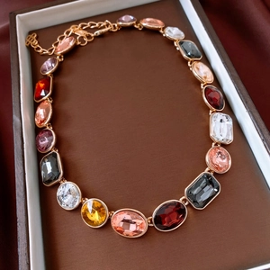 Macro shot of vintage crystal necklace in a brown gift box with elegant silk lining