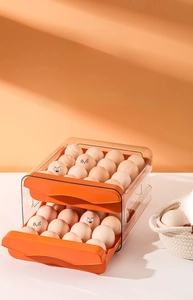 Dual-layer orange drawer-style egg storage box with individual slots for 32 to 40 eggs