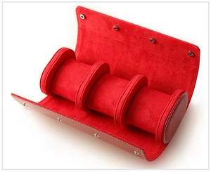 Internal view of red leather watch roll organizer with three soft velvet slots and snaps
