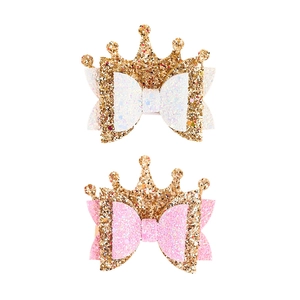 Sparkly gold crown bow hair clips for girls featuring shiny glitter fabric in pink and white