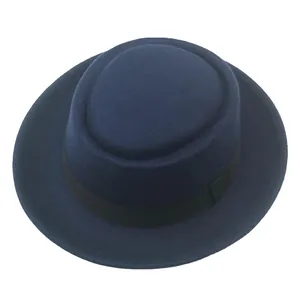 Navy blue wool felt pork pie hat with black ribbed band shown in a top-down view