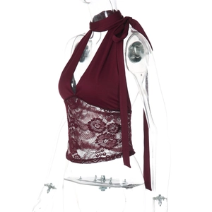Detailed view of the sheer floral lace panel on the burgundy halter neck tank top