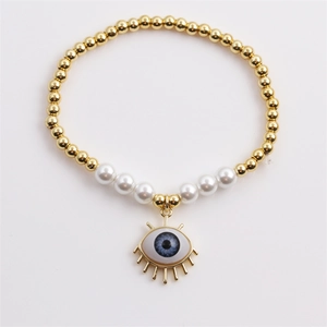 Bohemian gold beaded bracelet with white pearls and blue evil eye charm for women