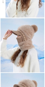 Detailed knit texture of a khaki winter balaclava with warm faux fur and brim