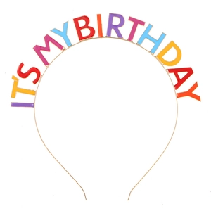 Detail of golden metal headband with colorful enamel IT'S MY BIRTHDAY letters