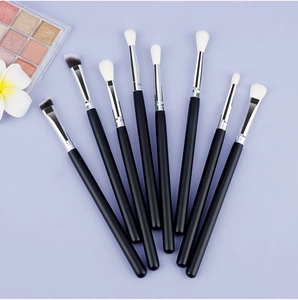 Detail view of 8 professional eye makeup brushes with matte black handles and silver ferrules