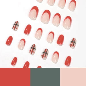 Short round Christmas press-on nails with red green plaid and french tip patterns