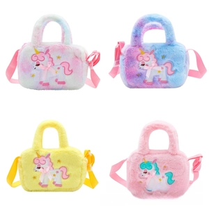 Detail of four colorful plush unicorn handbags with embroidery and ribbon bows