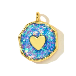 Detailed macro view of heart opal pendant with gold rim for DIY jewelry making