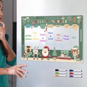 Detailed close-up of a Christmas acrylic magnetic weekly planner board with markers on a fridge