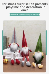 Close-up of three long-legged Christmas gnomes ornaments in grey, red and green outfits