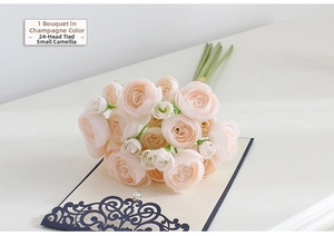 Detail of 24 champagne silk camellia buds bundled for wedding and home decoration
