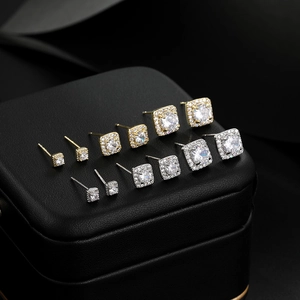 Three-pair set of gold and silver square stud earrings with cubic zirconia halo stones